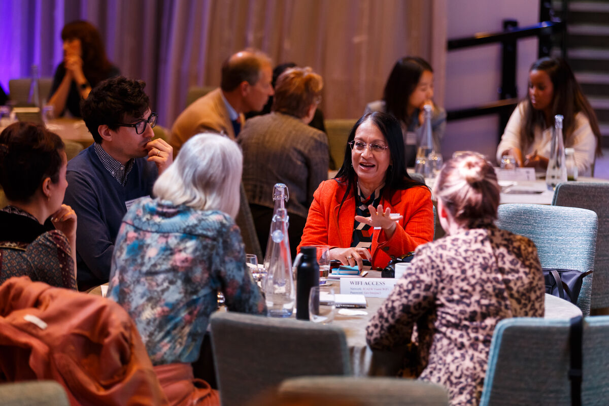 Attendees discussions at tables at For Thought 2023